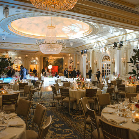 Elegant wedding at the Essex house in NYC with dramatic tall centerpieces.