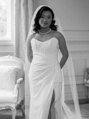 black and white portrait of bride in elegant wedding gown