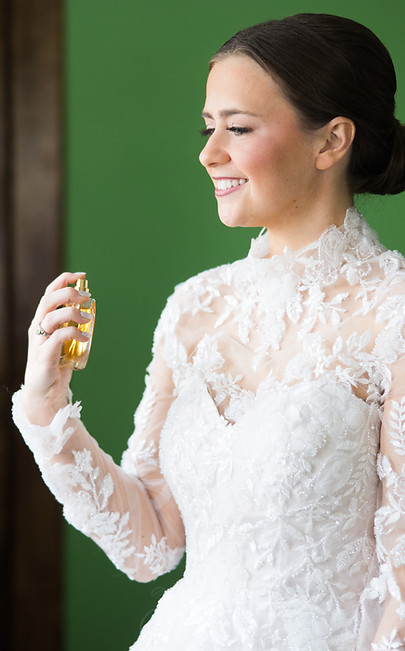 bride smiling with soft natural bridal makeup and elegant hairstyle