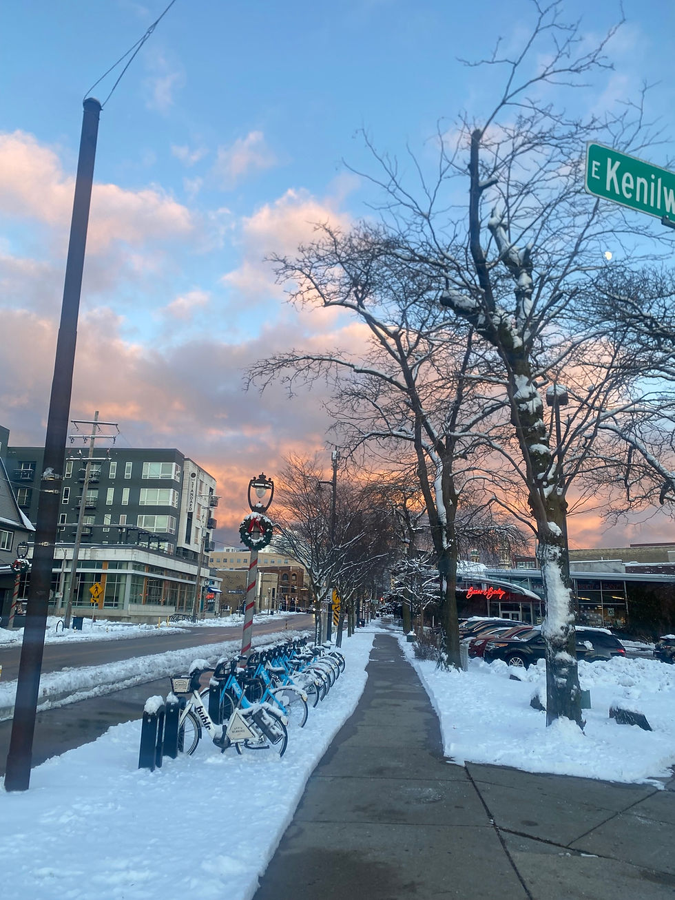 Beans & Barley pictured looking Eastward down North Avenue. There's a blue sky with pinkish orange clouds on the horizon.