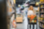 young-smiling-happy-woman-casual-clothes-shopping-supermaket-store-with-grocery-cart.jpg