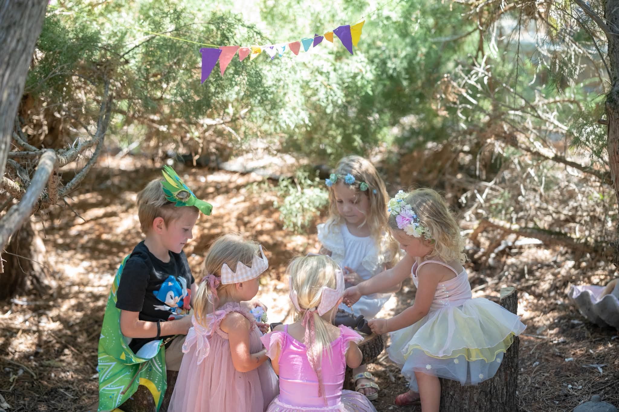 children dressed up playing fairy cave