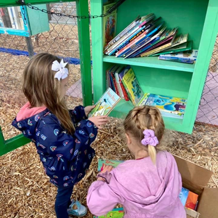Helping Dig It refill the Children’s Little Free Library. It’s a popular place to take a book, bring a book!