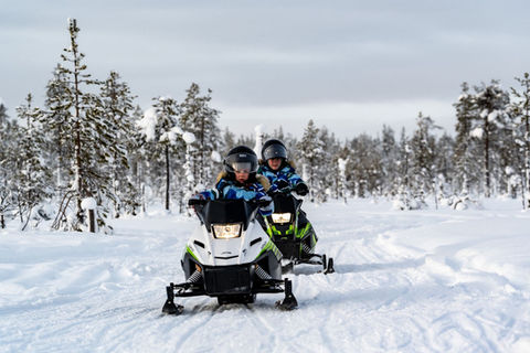 A family snowmobile safari where children drive their own mini-snowmobiles on a private track deep in the wilderness — three machine sizes, pre-heated kota hut, daytime departure.