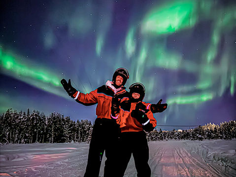 Evening snowmobile safari for adults with a kota hut stop on a frozen swamp — fire ready on arrival, 360-degree open sky, far from village lights.