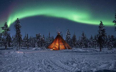 A peaceful Arctic sled journey through Lapland’s wilderness to the Northern Lights