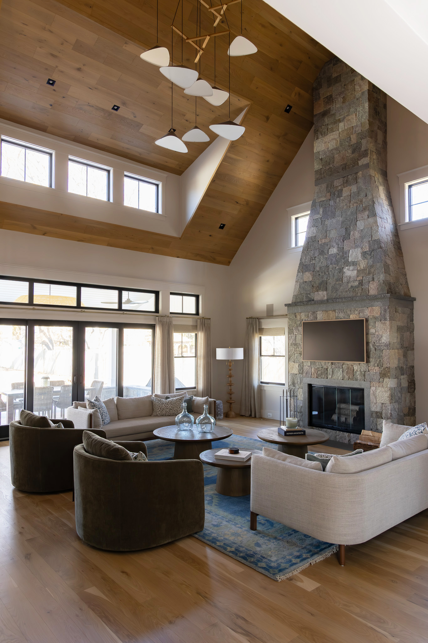 Reflected ceiling plan lighting in a double-height interior with an Emily V8 anthracite vertical composition