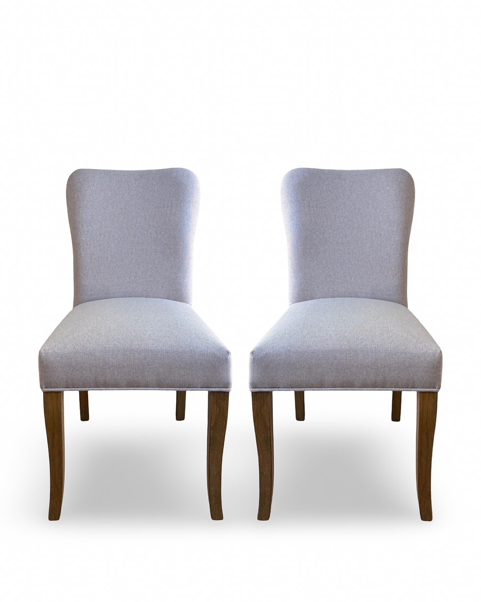 Stratford Dining Chairs upholstered in premium linen-look fabric, featuring a slim, space-saving silhouette and comfortable