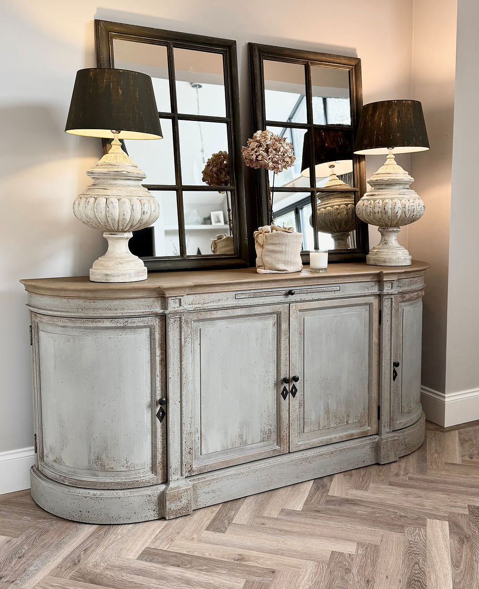 Grey four-door sideboard with curved ends, adjustable shelves, and a gently distressed finish