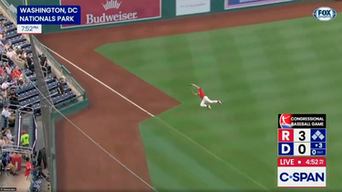U.S. Senator Eric Schmitt making a diving catch. 