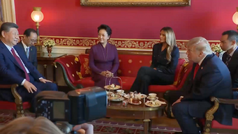 President Xi Jinping and President Trump accompanied by their wives and translators.