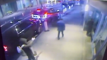 Surveillance video showing Luigi Mangione allegedly shooting a healthcare CEO in the back.