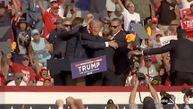 Donald Trump after being shot in the ear at a campaign event in 2014.