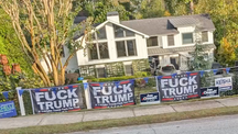 An Atlanta property covered in profane anti-Trump signs.