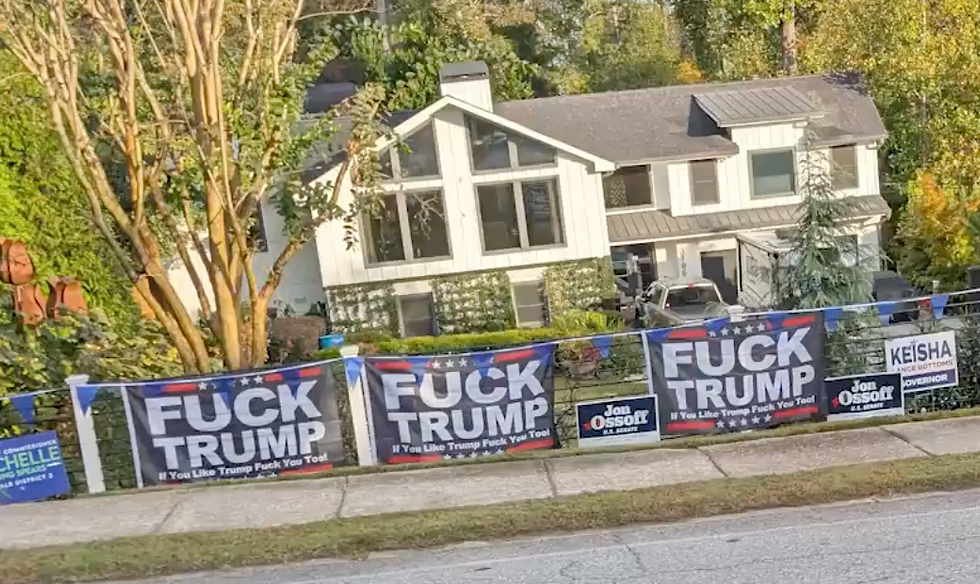 An Atlanta property covered in profane anti-Trump signs.