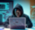 Firefly hacker wearing black hoodie with his laptop sitting in a cyber lab 49560_edited.jp