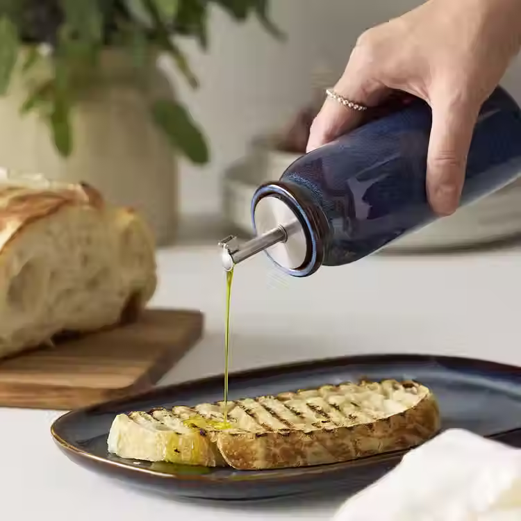 Thumbnail: IndigoDrizzle - Blue colored ceramic bottle with metal pour spout