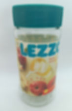 Glass jar with plastic lid and bold "LEZZO" apple tea label.