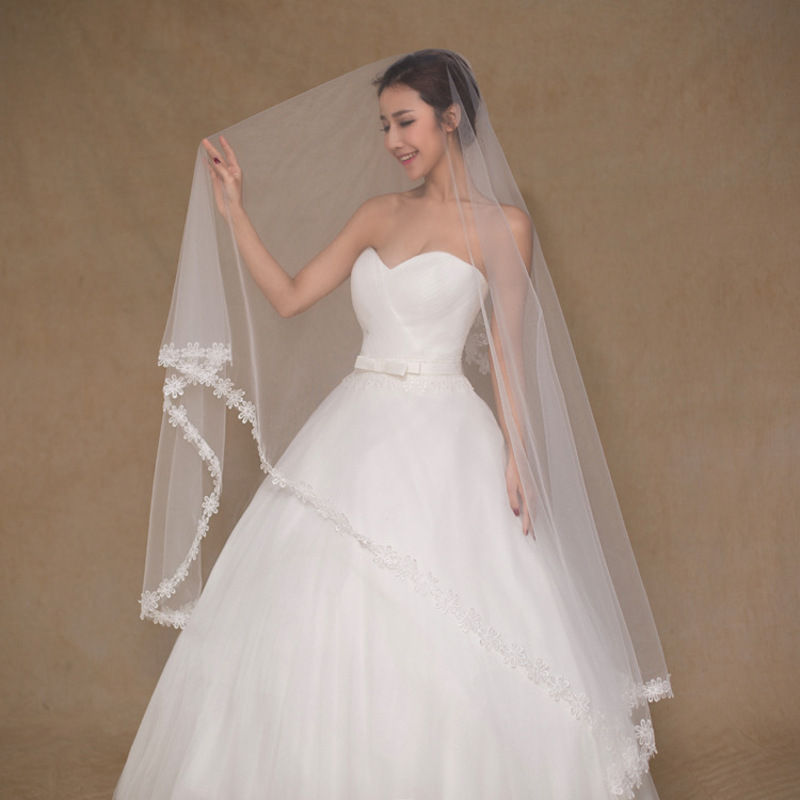 Bride in white wedding dress and veil