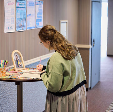 Woman signing register at Corporate Events