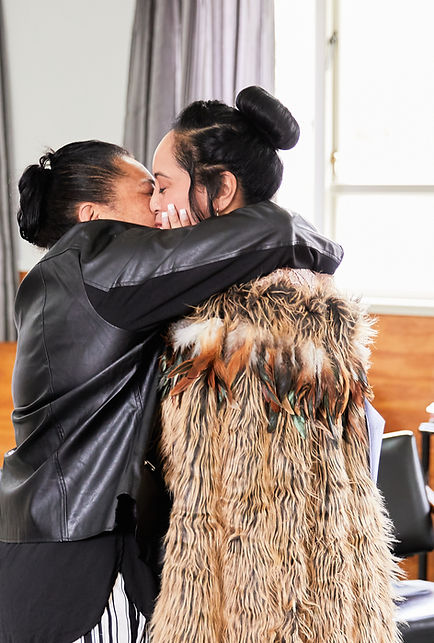 Two women embracing passionately
