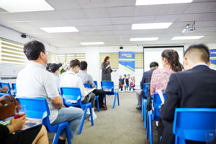 Businesswoman giving presentation to attentive audience