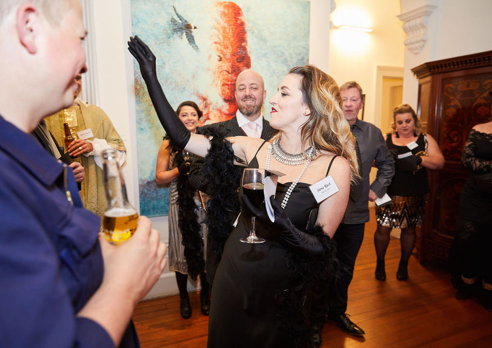 Woman in flapper dress at corporate event