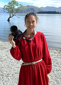 Woman in red dress, camera, lake