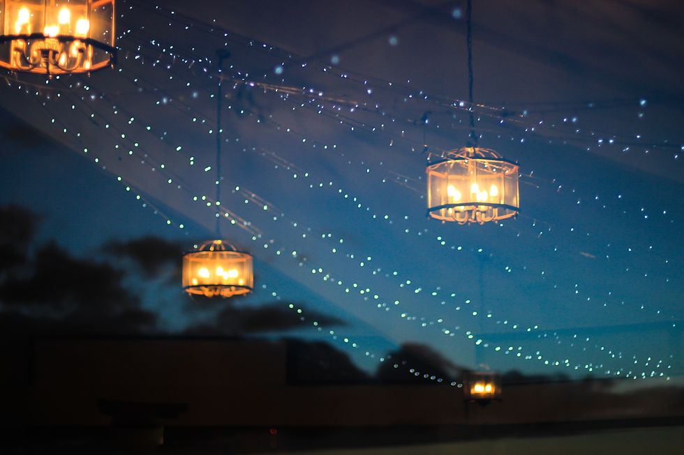 Elegant chandeliers and fairy lights illuminate the night sky