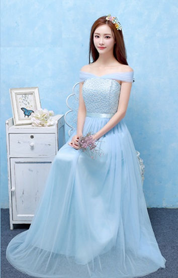 Woman in light blue bridesmaid dress