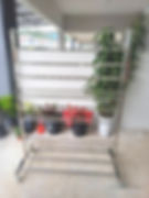 Metal plant stand with potted plants
