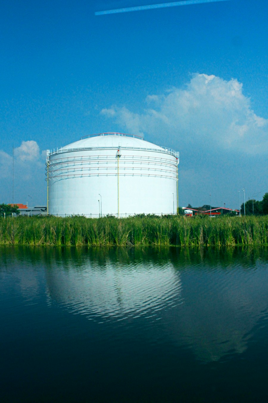 Large storage tank beside water