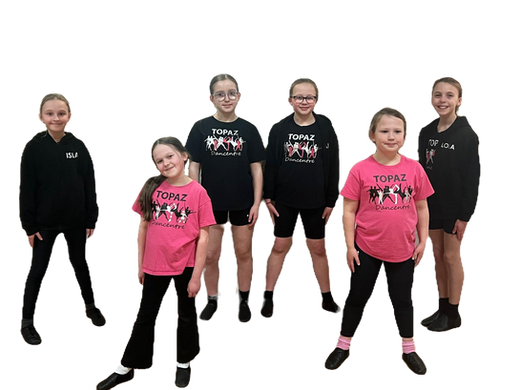 Six pre-teen girls, posed symmetrically. They are wearing a range of Topaz Branded items; hoodies, jumpers and T shirts, with black legwear and black jazz shoes.