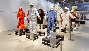 Installation shot showing workwear garments on display as part of 'Workwear' exhibition.