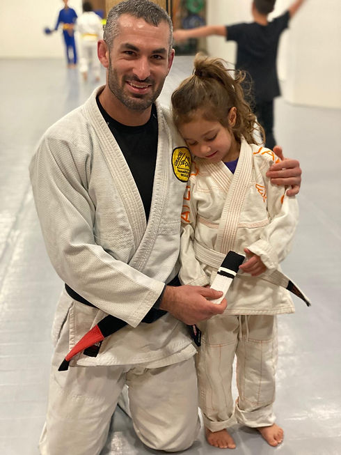 Zach with kid with stripe promotion.jpeg