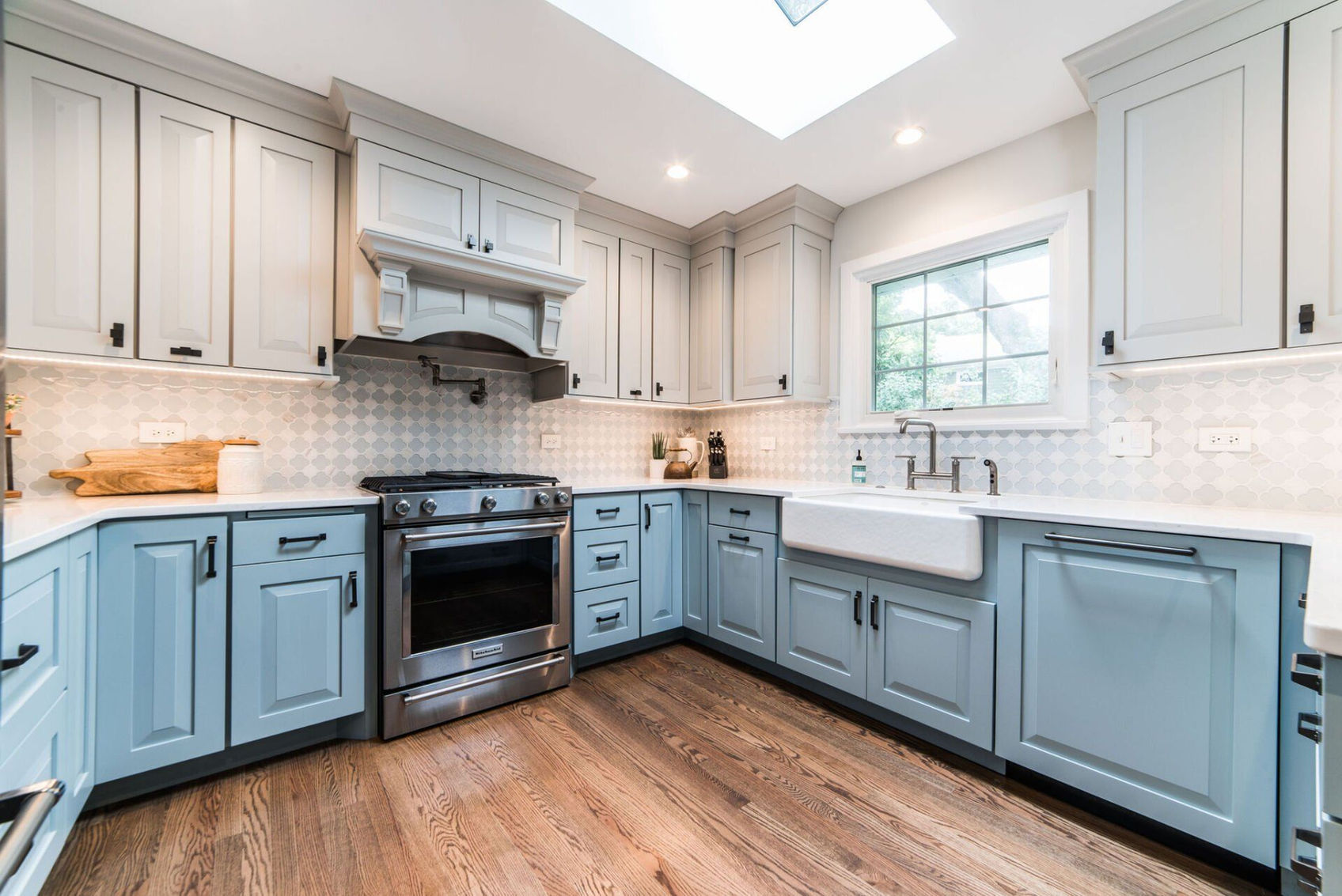 blue and white kitchen remodel, light wood floorboards