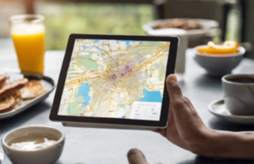 person holding a tablet with an image of a map