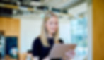 blonde-woman-smiling-using-tablet-in-modern-office-2026-06-02-15-54-18-utc.jpg