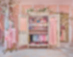 Ornate open wardrobe filled with pink dresses in a decorative room