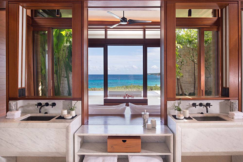 Luxury bathroom with double vanity and ocean view