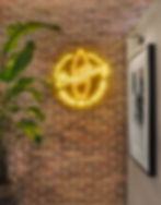 Breitling neon sign with 'Squad On A Mission' text & surfboard.