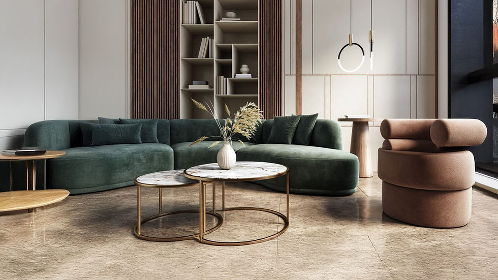 Modern living room with a green velvet sectional sofa, round marble-top coffee tables with gold frames, a unique circular beige lounge chair, and built-in shelving against a wood-paneled wall.