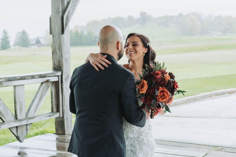 Romantic first look of bride and groom sharing an intimate moment before the ceremony, photographed with elegant, editorial style