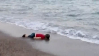 Aylan Kurdi, a drowned young victim of the Syrian conflict symbolizing the plight of refugees. | A Poem About God