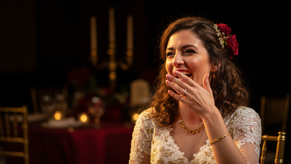 Close-up view of a candid moment with a bride laughing during the wedding reception