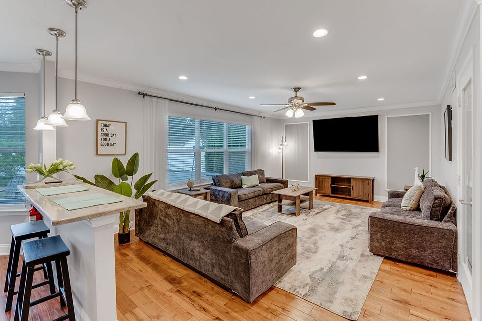 Modern living room with grey sofas and hardwood floors