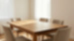 Wooden dining table with chairs in a sunlit room