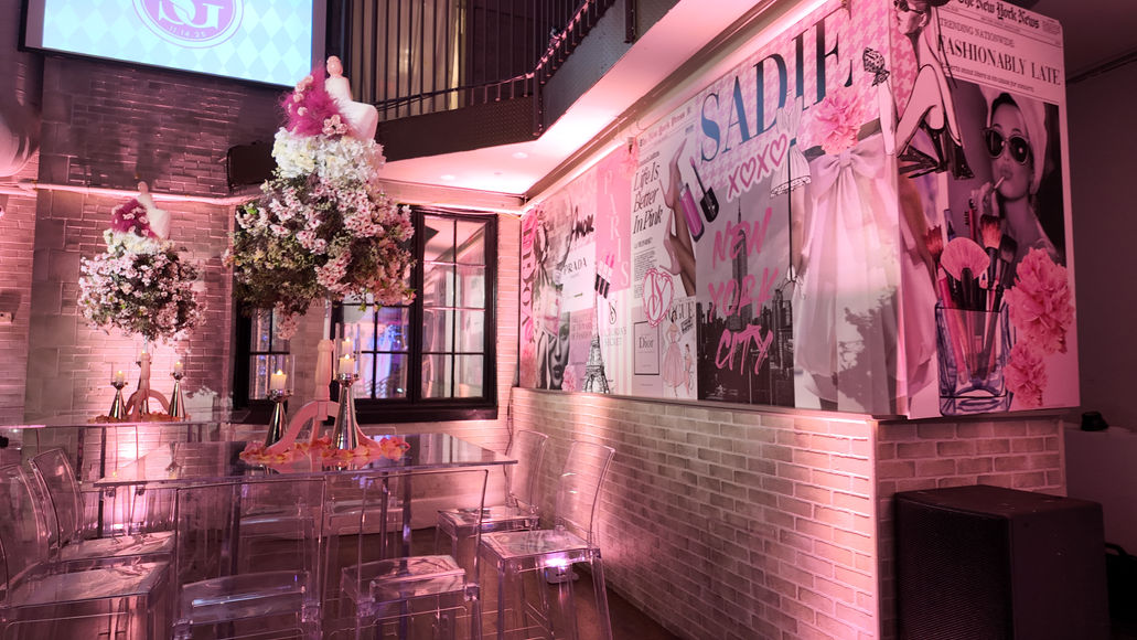 Custom fabrication and installation of a branded bar area featuring custom collage-inspired artwork, themed graphics, and an immersive photo opportunity.