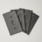 4 charcoal Gray switch plates on white background