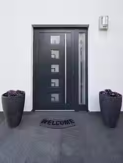 front-door-with-welcome-rug-flowers-pot_1048944-26991203
